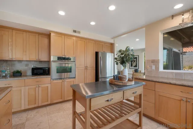 a view of balcony with wooden floor and fence
