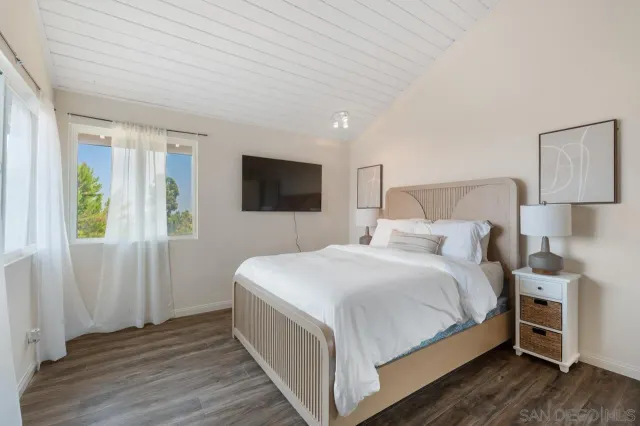 an aerial view of a house with a garden and trees