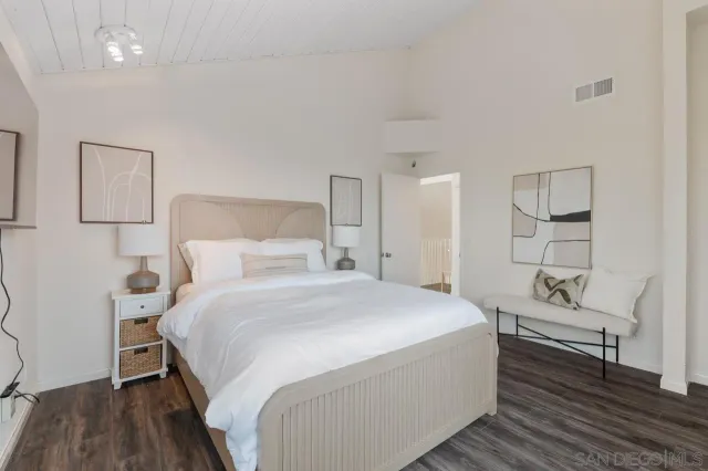 an aerial view of residential houses with outdoor space and river