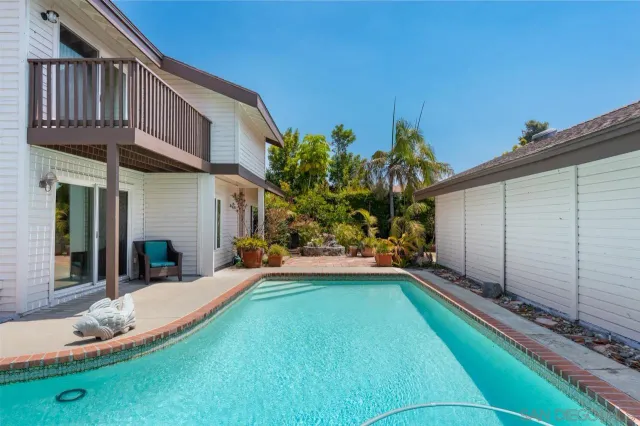 a balcony with furniture and city view