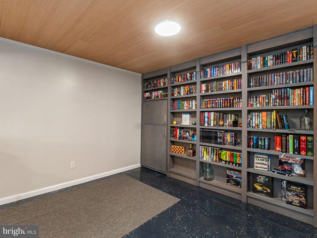 10411 Hidden Lake Lane Rixeyville, VA 22737 - Photo 25 of 35 Built In Bookcase w/ Fridge