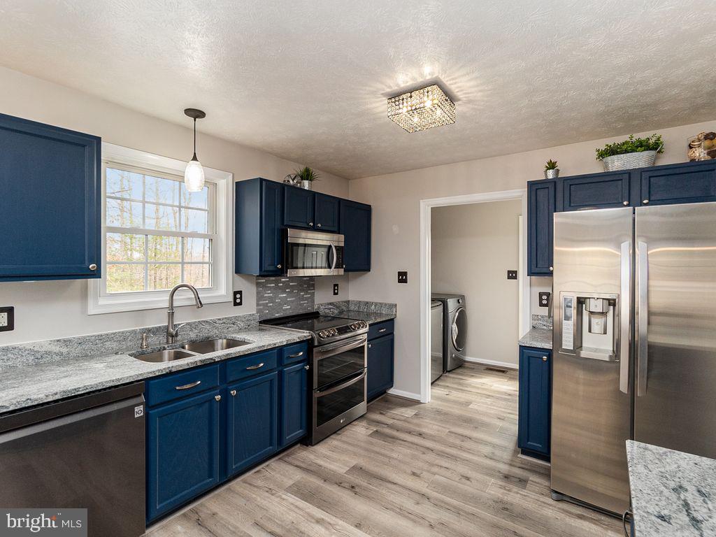 10411 Hidden Lake Lane Rixeyville, VA 22737 - Photo 6 of 35 Kitchen w/ Granite and Stainless