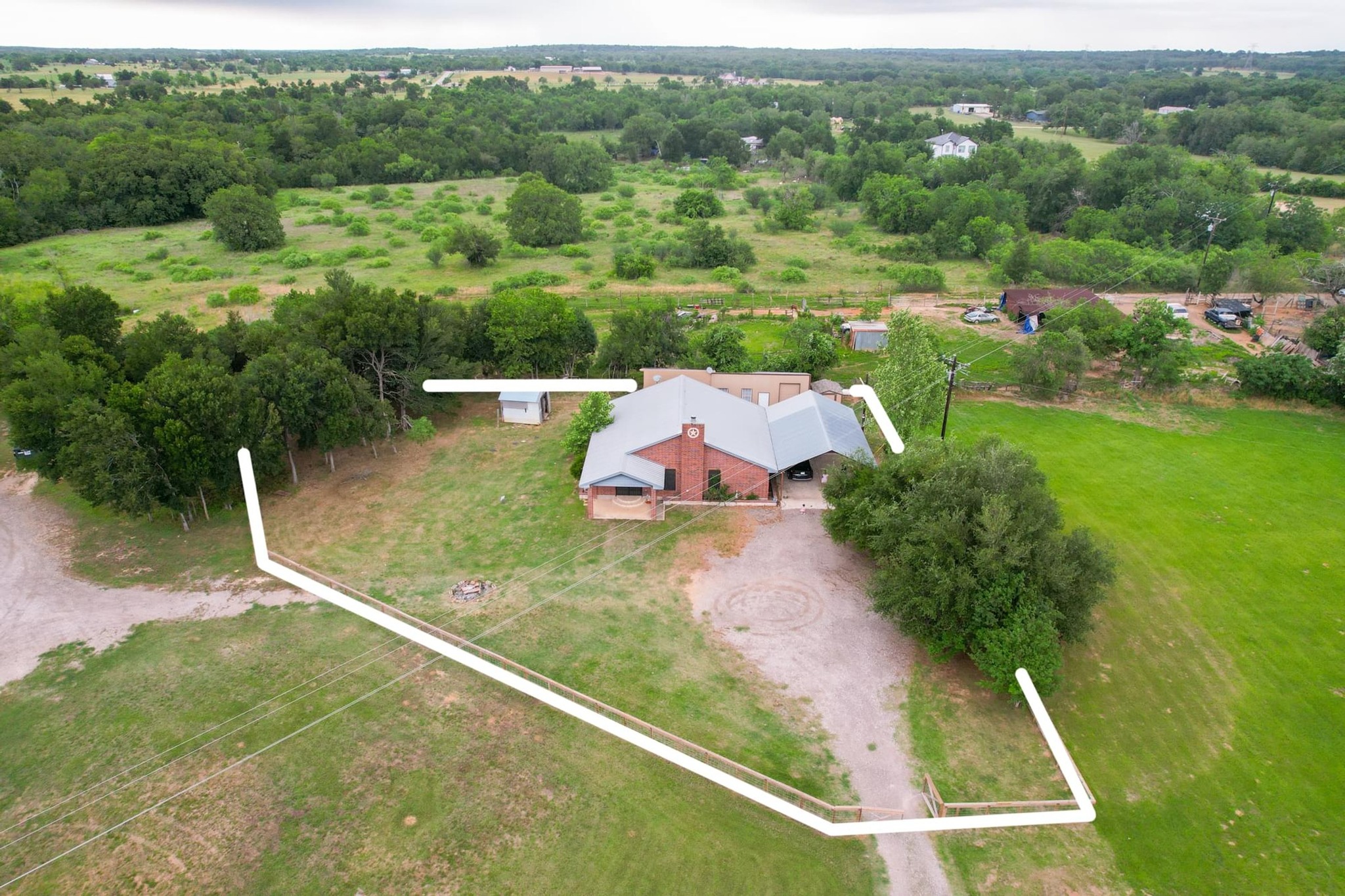 176 Old Lexington Road, Unit C Elgin, TX 78621 - Photo 23 of 31 an aerial view of a house with a yard