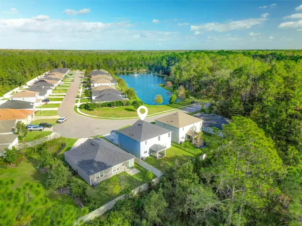 a view of a lake with a yard