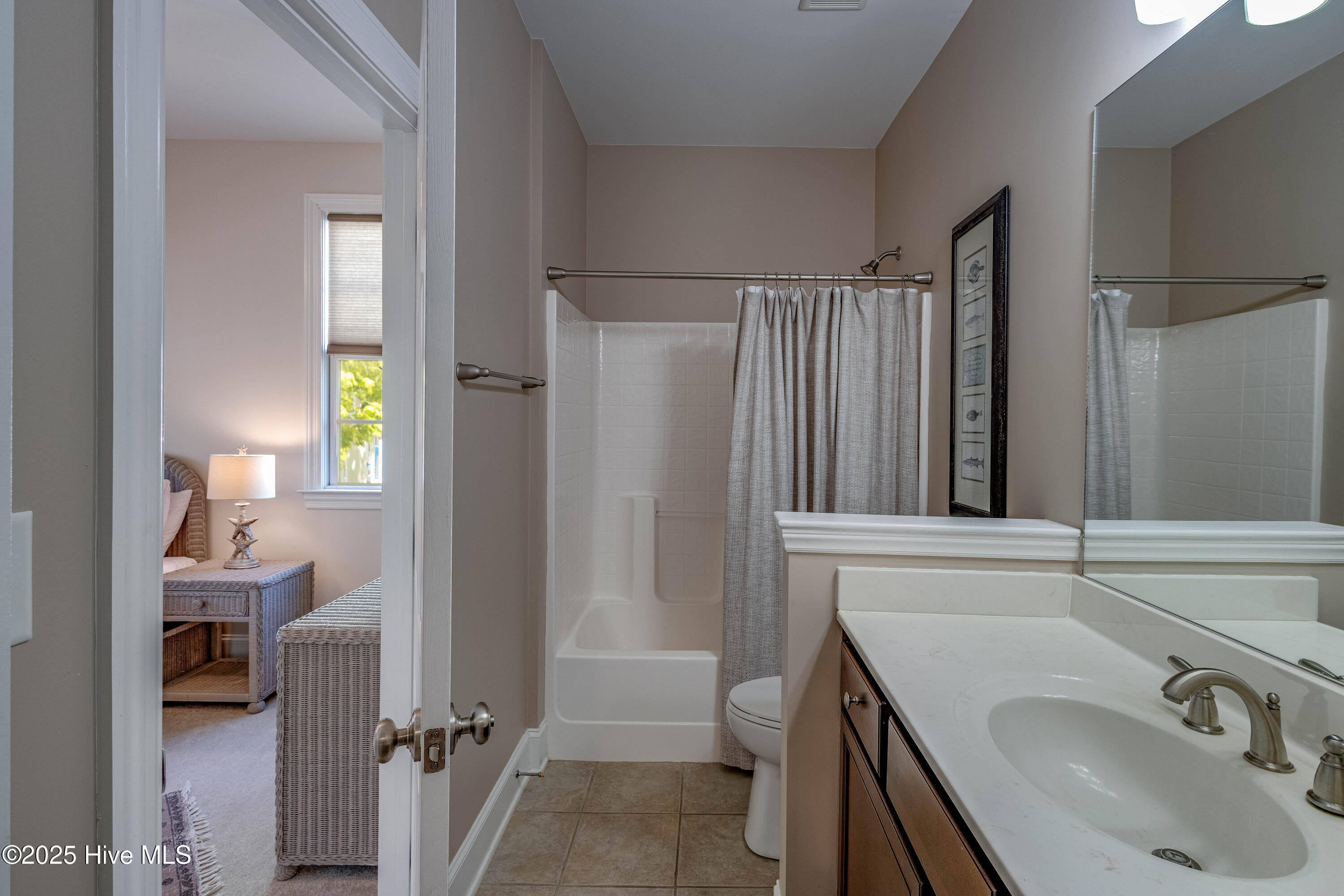 207 South Academy Street Washington, NC 27889 - Photo 14 of 42 Main Floor Bathroom that adjoins to bedroom.