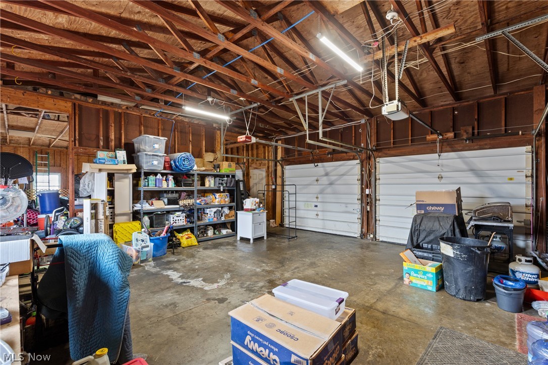 64508 Slade Road Cambridge, OH 43725 - Photo 35 of 50 Garage featuring a garage door opener
