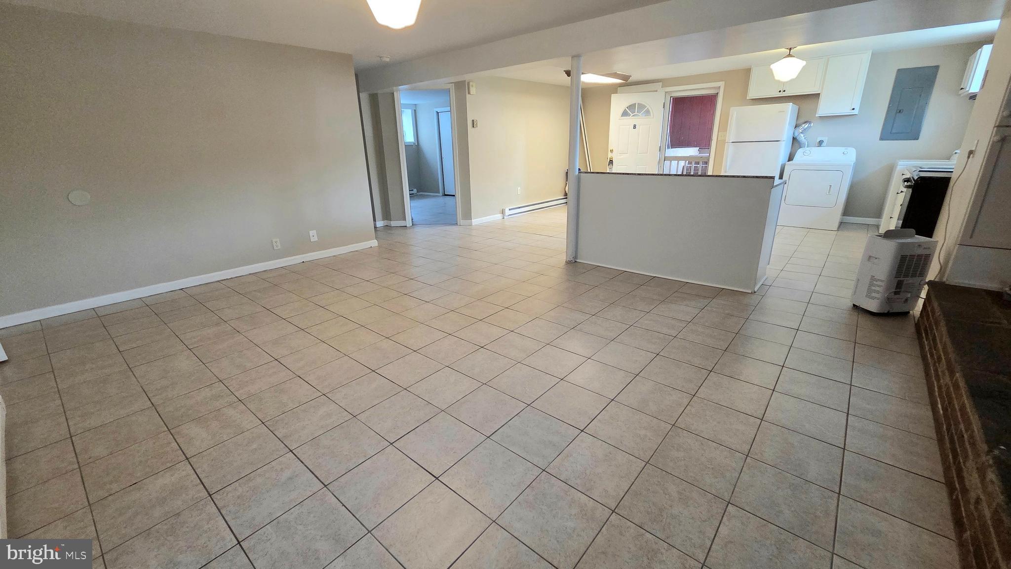 4400 4th Street Baltimore, MD 21225 - Photo 23 of 25 a view of a kitchen and utility area