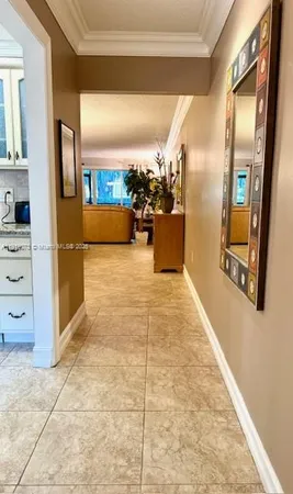 a view of a hallway with living room