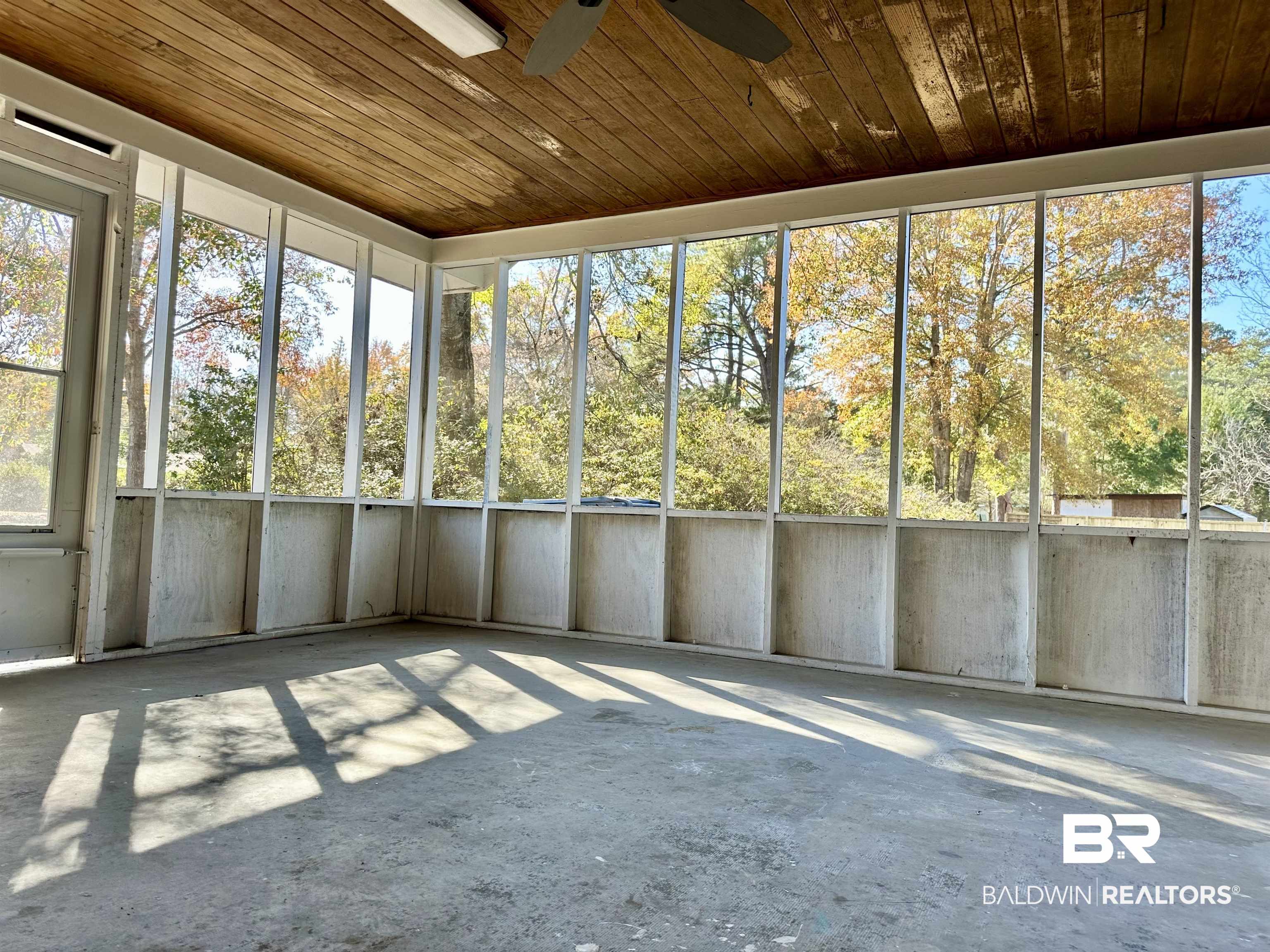 103 Avalon Street Brewton, AL 36426 - Photo 12 of 14 Unfurnished sunroom with ceiling fan and wood ceiling