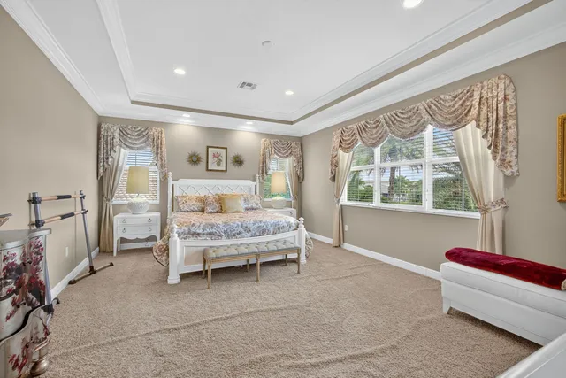 an aerial view of residential houses with outdoor space and lake view