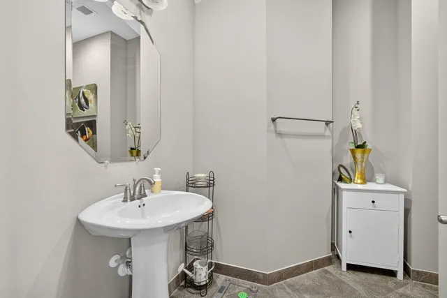 a living room with furniture and a dining table