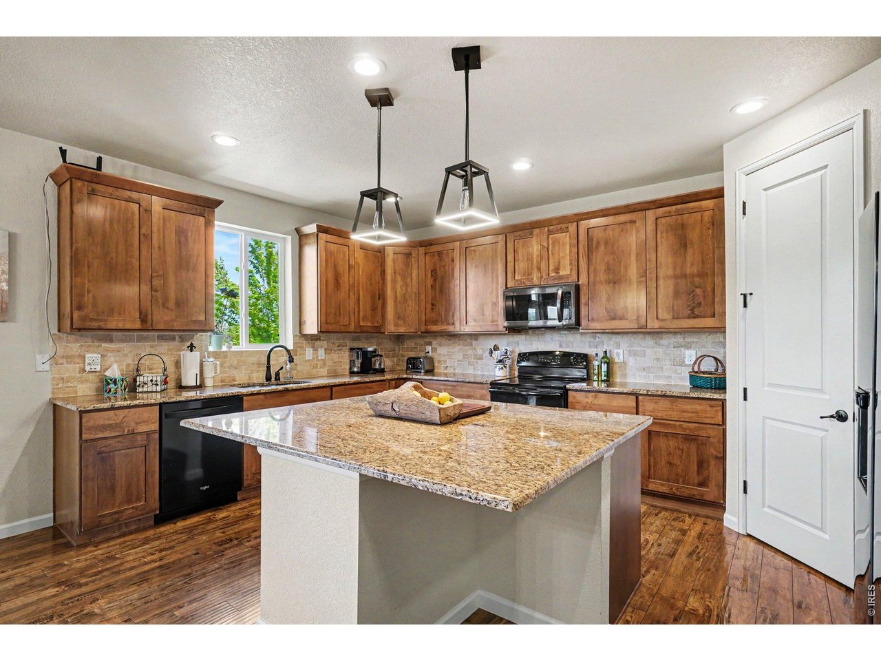 1124 Wagon Bend Road Berthoud, CO 80513 - Photo 11 of 38 kitchen & pantry on right