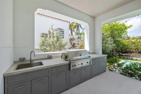 a bathroom with a granite countertop sink a toilet and mirror