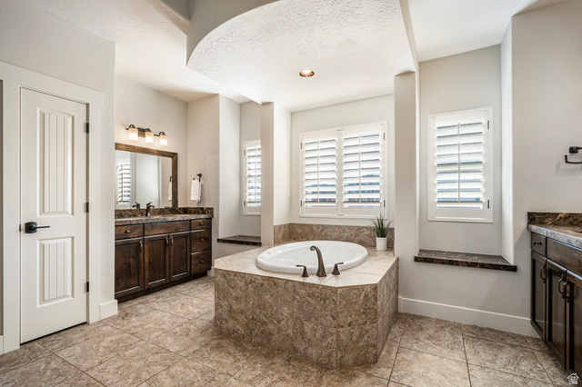 2311 South 1340 West St. George, UT 84770 - Photo 33 of 56 Bathroom with vanity, a garden tub, and recessed lighting