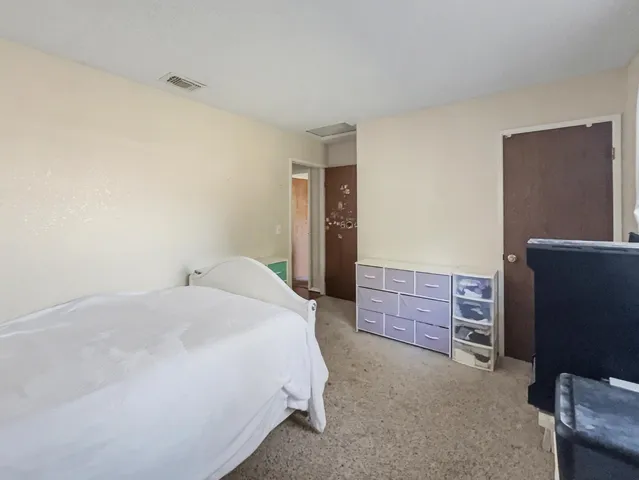 a room with a bed and furniture