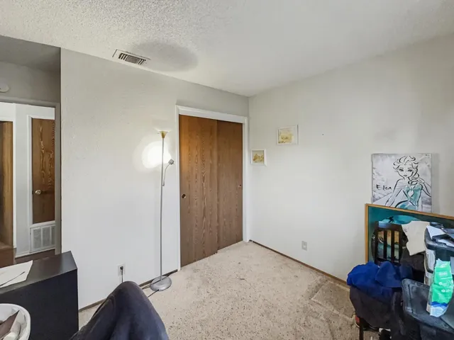 a bedroom with a bed and furniture