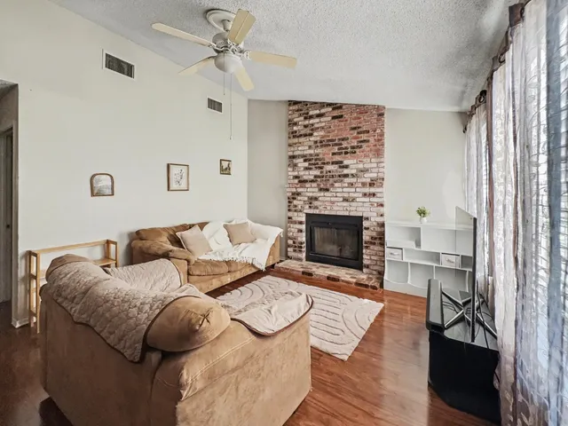 a bedroom with a bed and a fireplace