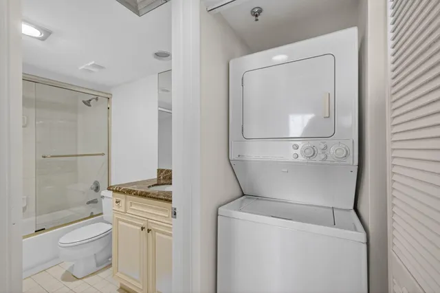 a view of a hallway with wooden floor and stairs