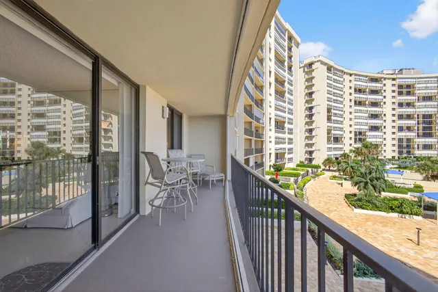 a living room with furniture a dining table and chairs
