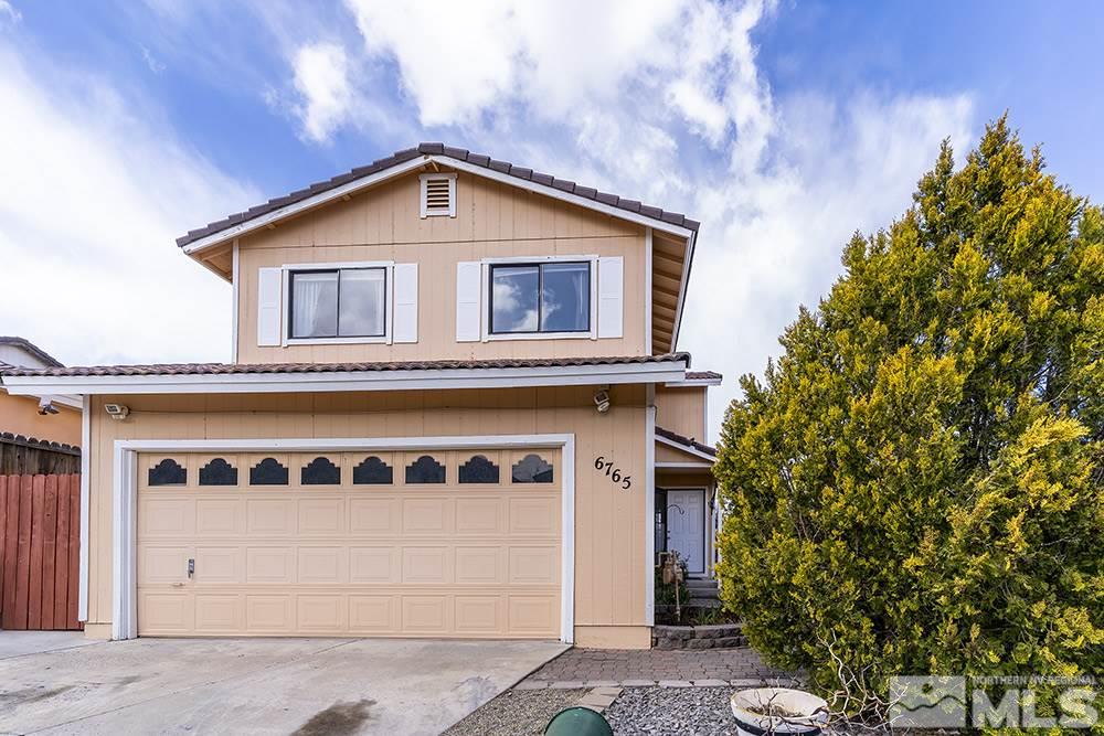 6765 Peppermint Court Reno, NV 89506 - Photo 1 of 22 a front view of a house with a yard