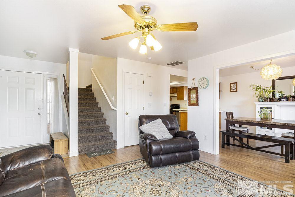 6765 Peppermint Court Reno, NV 89506 - Photo 3 of 22 a living room with furniture and wooden floor