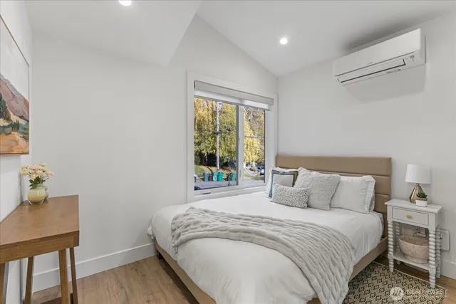 a bedroom with a bed and a table in it