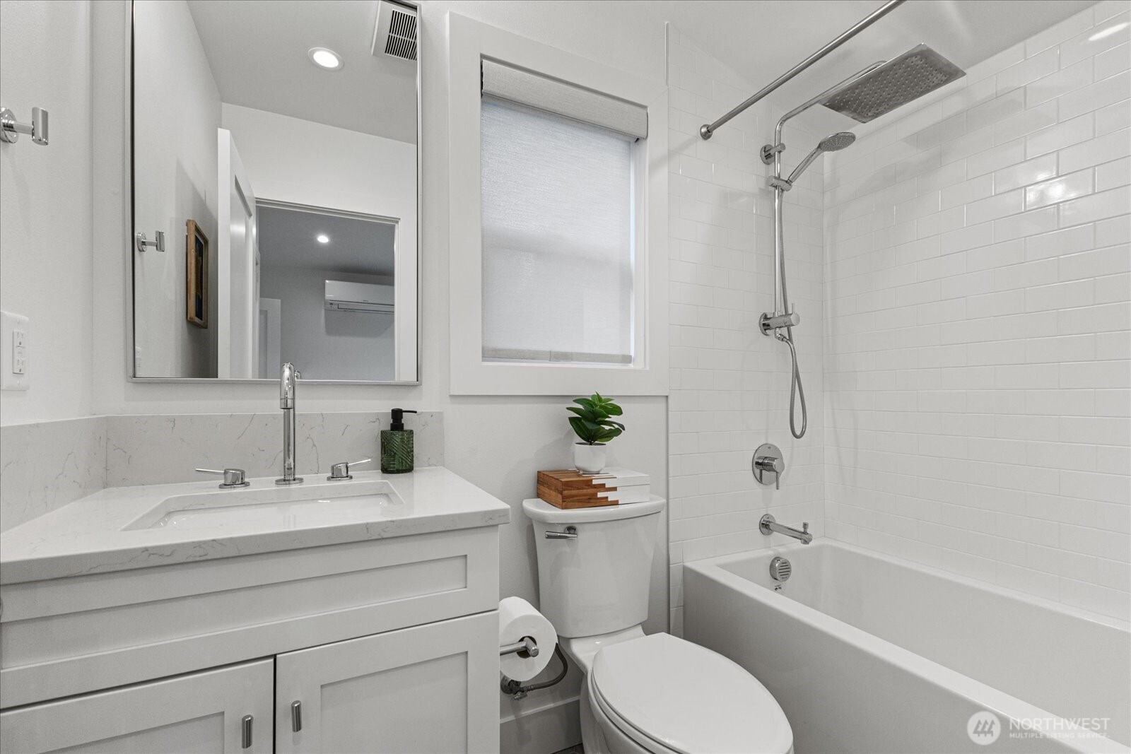 3537 Northeast 93rd Street Seattle, WA 98115 - Photo 17 of 22 a bathroom with a sink toilet vanity and shower