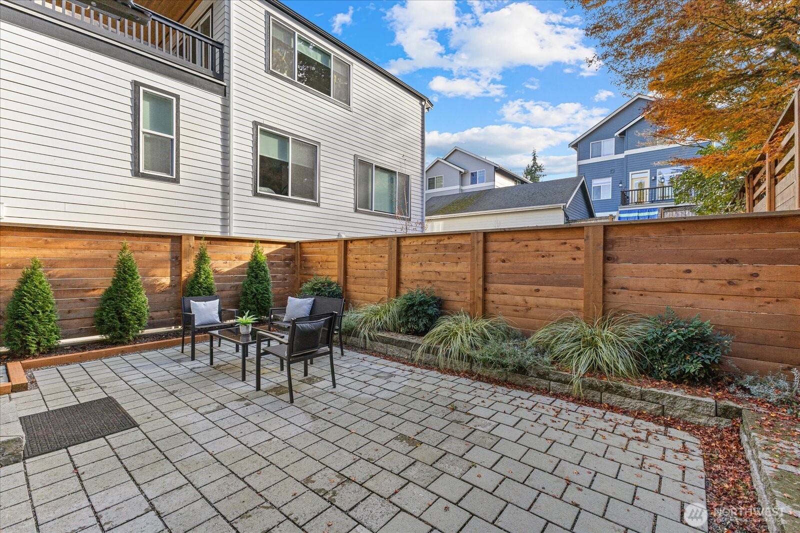 3537 Northeast 93rd Street Seattle, WA 98115 - Photo 20 of 22 a view of a patio with table and chairs and potted plants