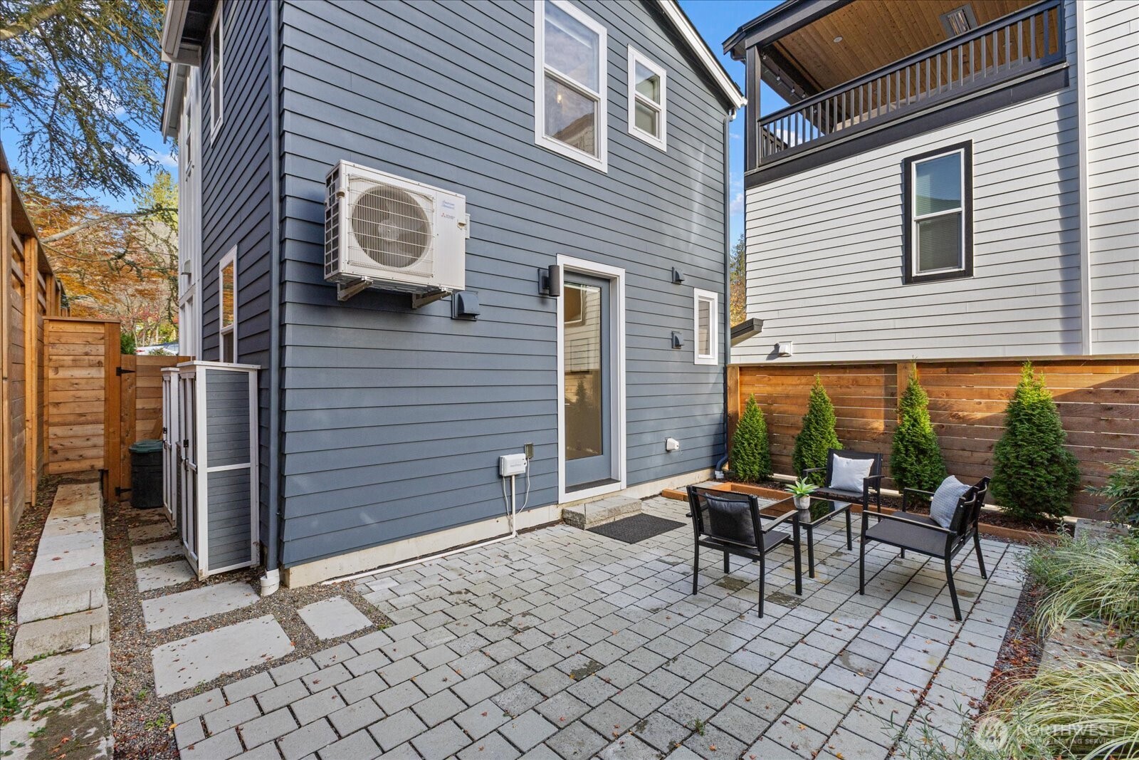 3537 Northeast 93rd Street Seattle, WA 98115 - Photo 21 of 22 a backyard of a house with outdoor seating