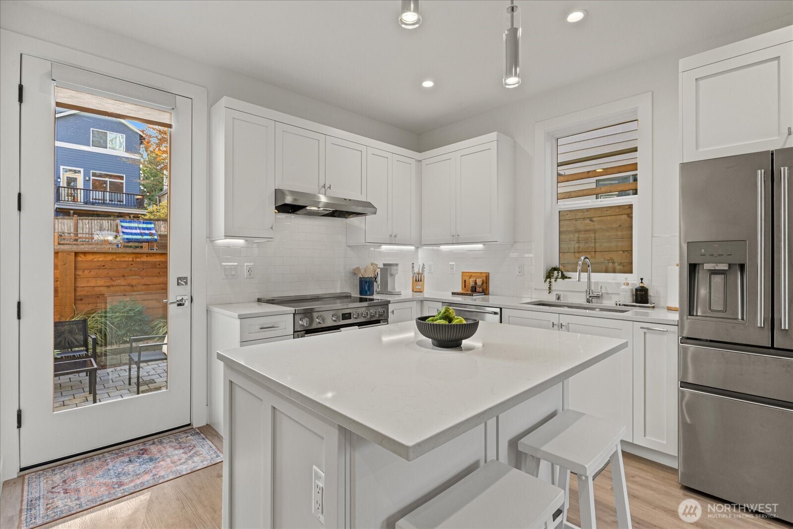 3537 Northeast 93rd Street Seattle, WA 98115 - Photo 3 of 22 a kitchen with a stove a refrigerator and a sink