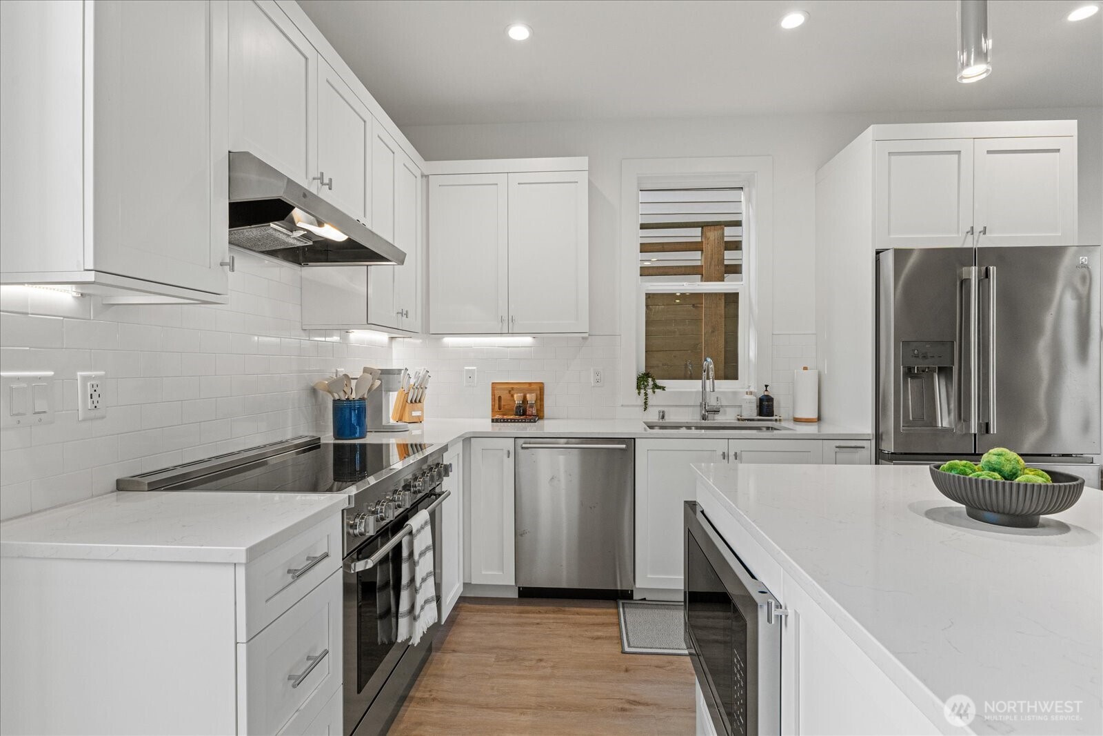 3537 Northeast 93rd Street Seattle, WA 98115 - Photo 7 of 22 a kitchen with a sink a stove and cabinets