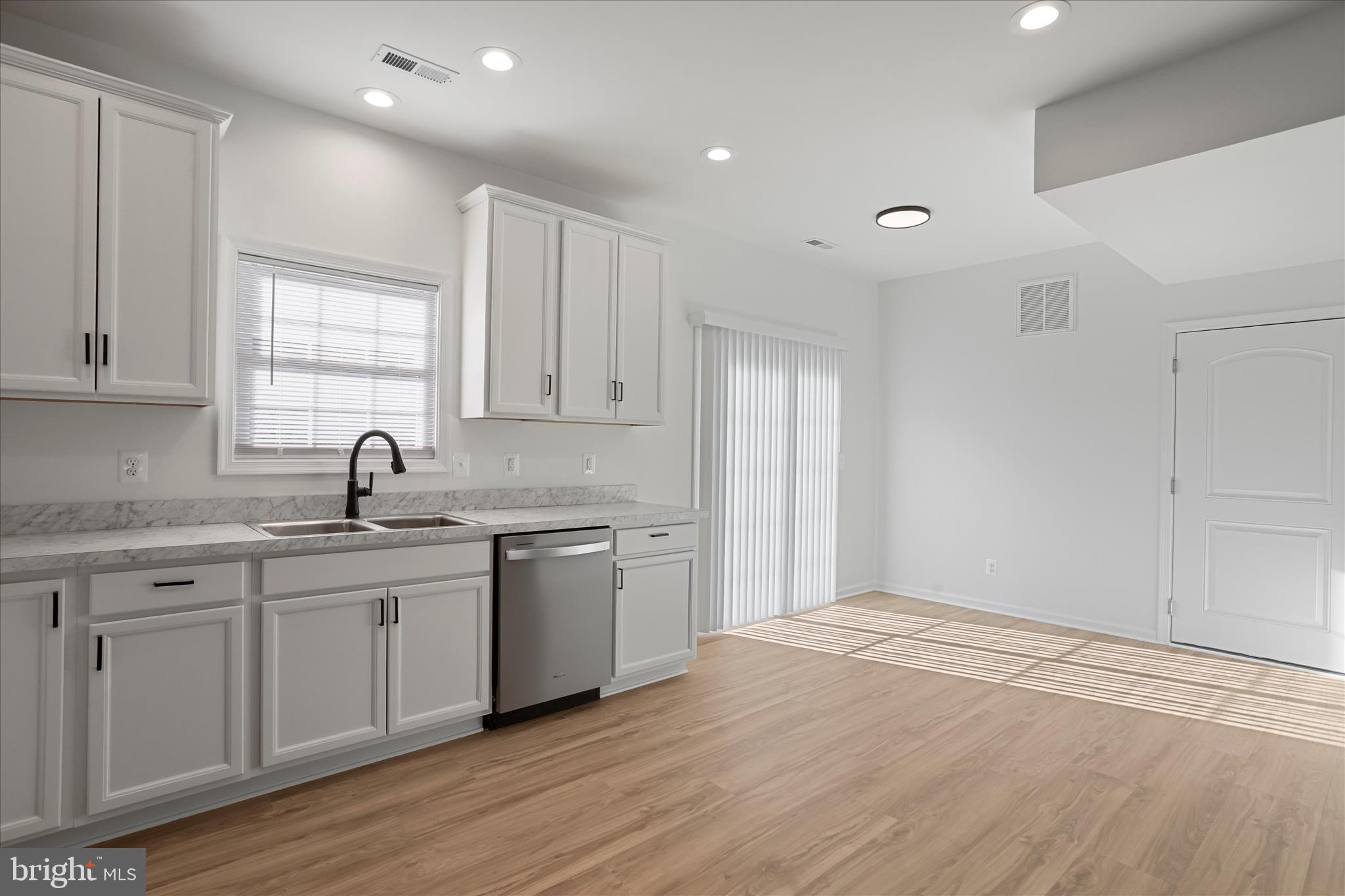 118 Windsor Knit Road Edinburg, VA 22824 - Photo 13 of 34 a kitchen with a sink cabinets and wooden floor