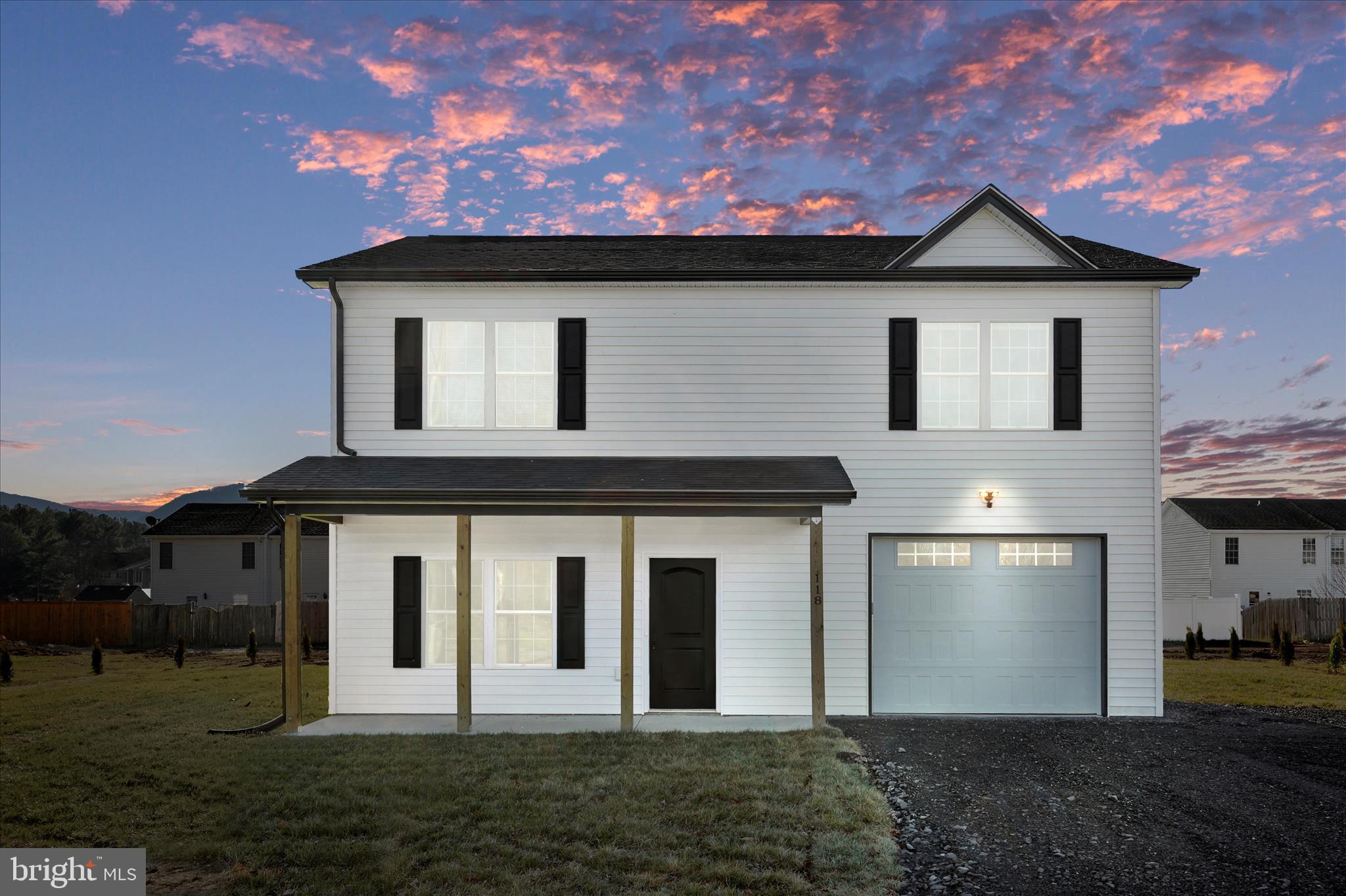 118 Windsor Knit Road Edinburg, VA 22824 - Photo 2 of 34 a front view of a house with a garden