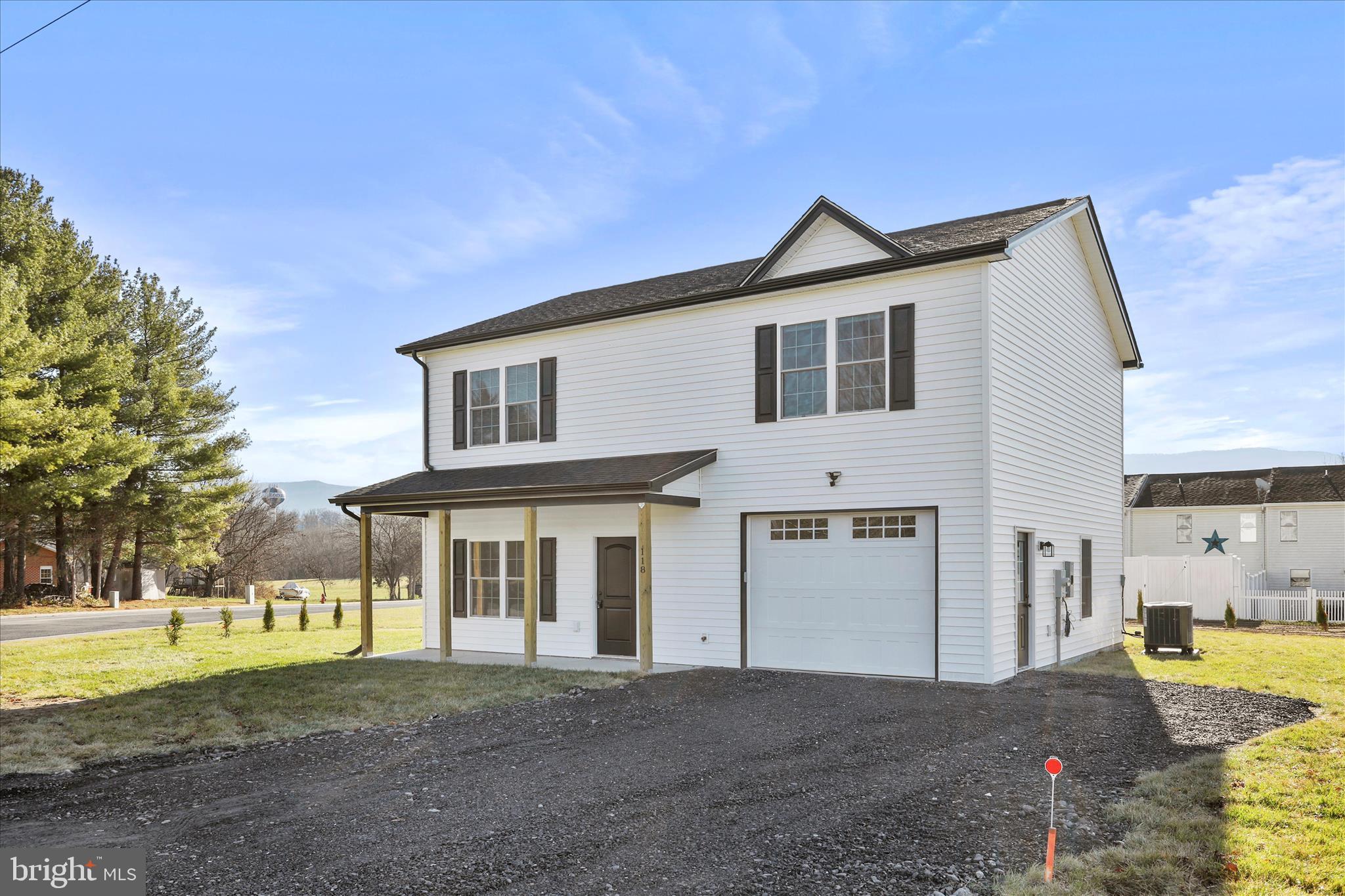 118 Windsor Knit Road Edinburg, VA 22824 - Photo 3 of 34 a front view of a house with a yard and garage