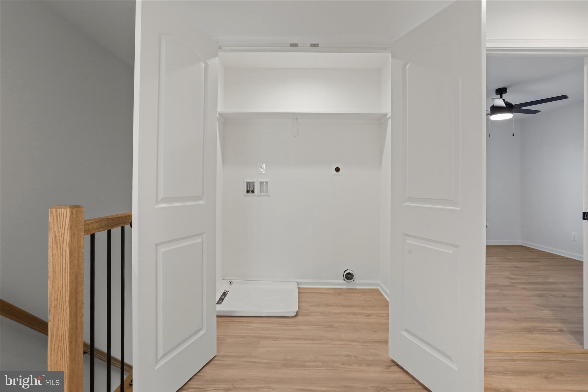 118 Windsor Knit Road Edinburg, VA 22824 - Photo 31 of 34 a view of a hallway with wooden floor and closet