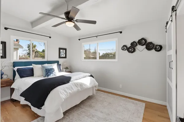 a bed room with a bed and a window