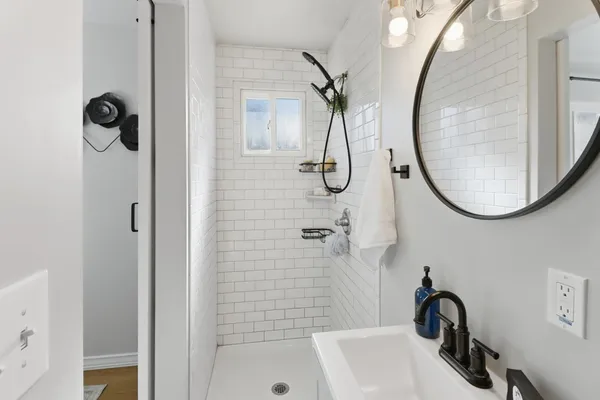 a bathroom with a sink and a mirror