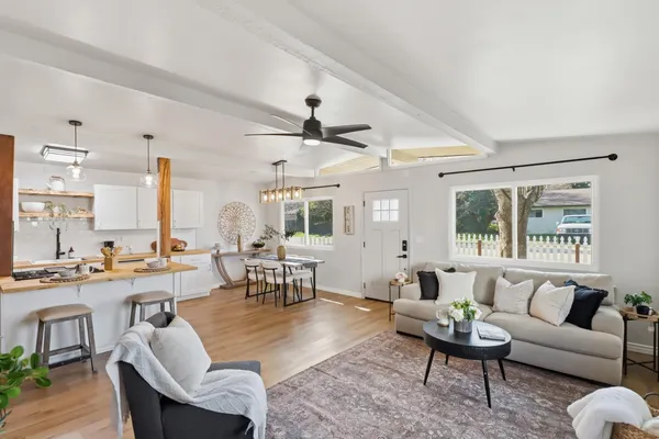 a living room with furniture and a large window