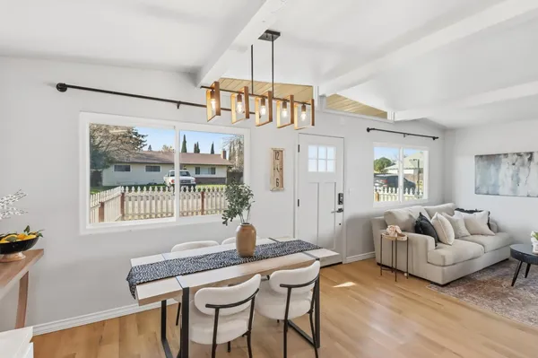 a view of a livingroom with furniture window and wooden floor