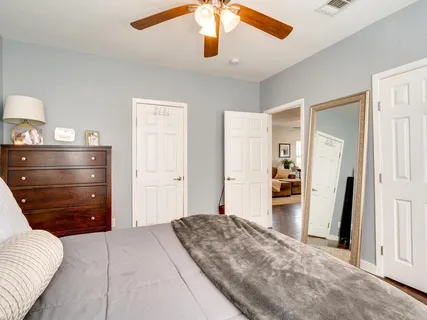 a bedroom with a bed and a walk in closet