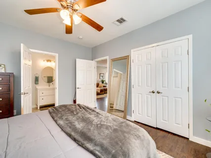 a bedroom with a bed and a chandelier