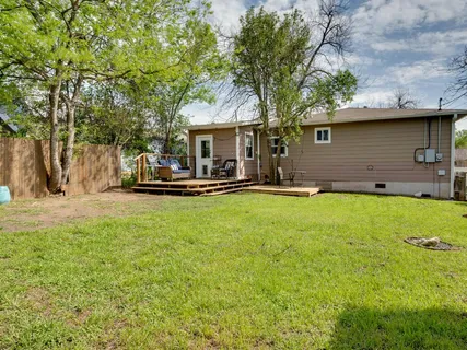 a front view of house with yard and trees