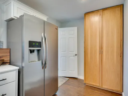 a view of cabinets and wooden floor