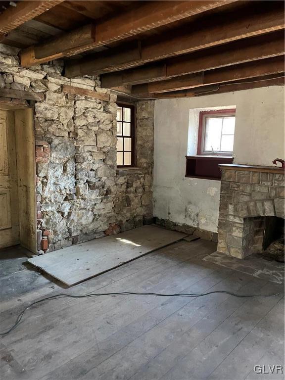 3835 Forest Inn Road Palmerton, PA 18071 - Photo 13 of 44 LIVING ROOM WITH EXPOSED STONE WALL AND CEILING JO