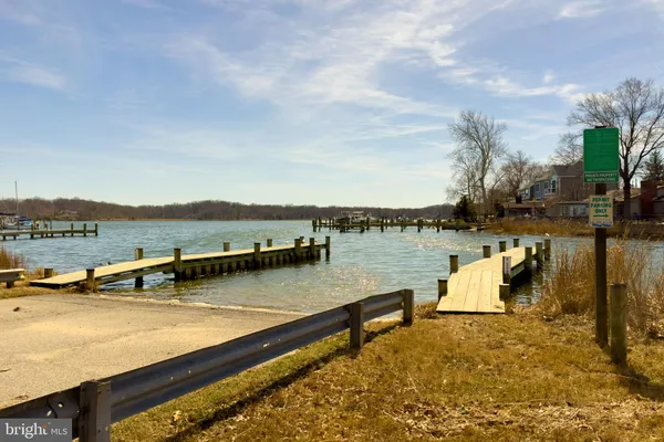 a view of lake with a table and chairs