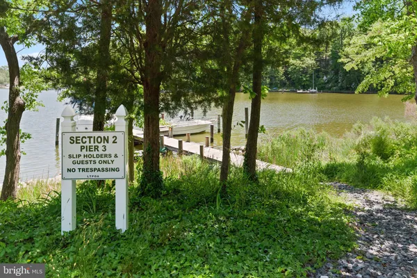 a view of a wooden bench and lake