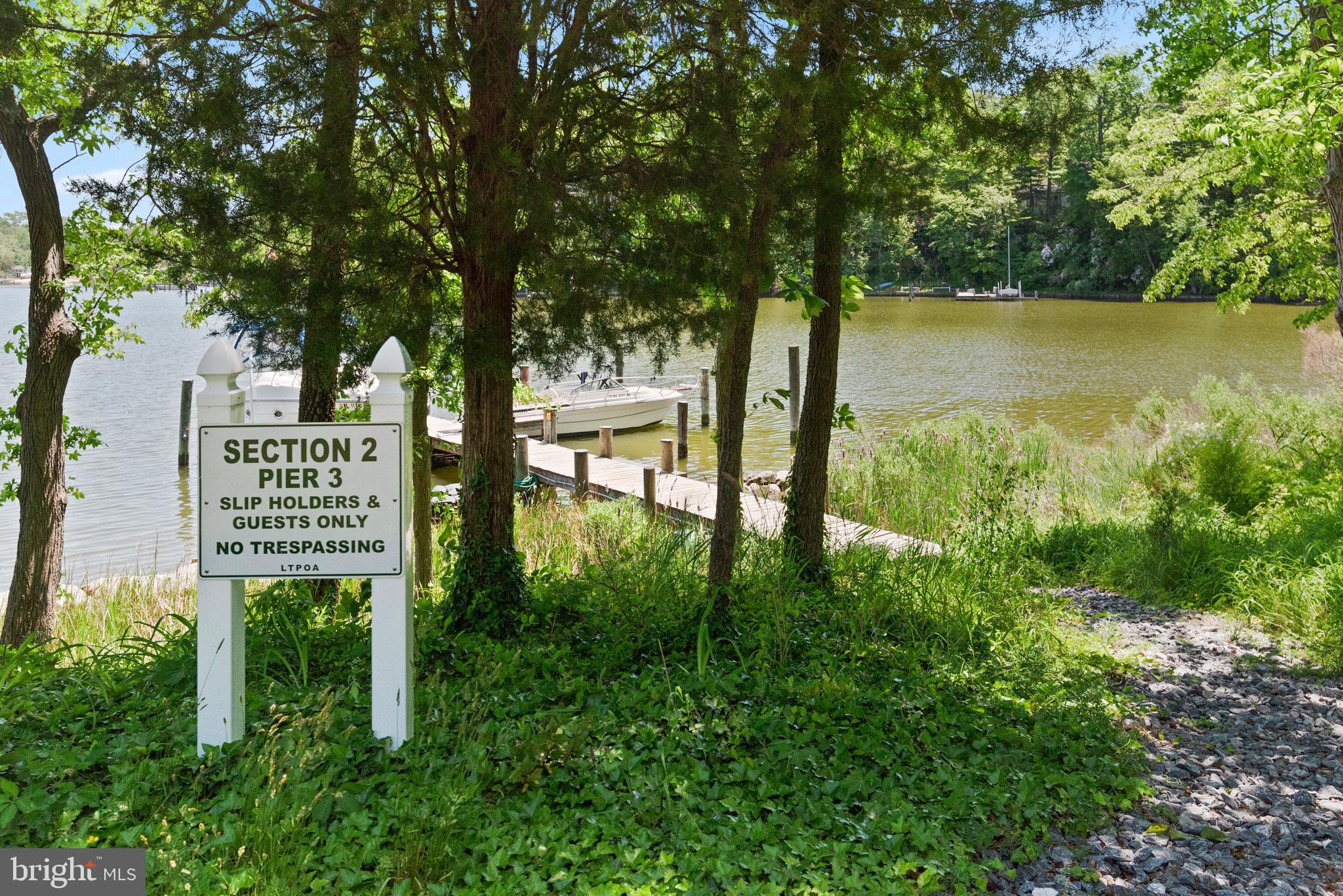 1505 Grange Road Edgewater, MD 21037 - Photo 15 of 45 a sign on the side of the river