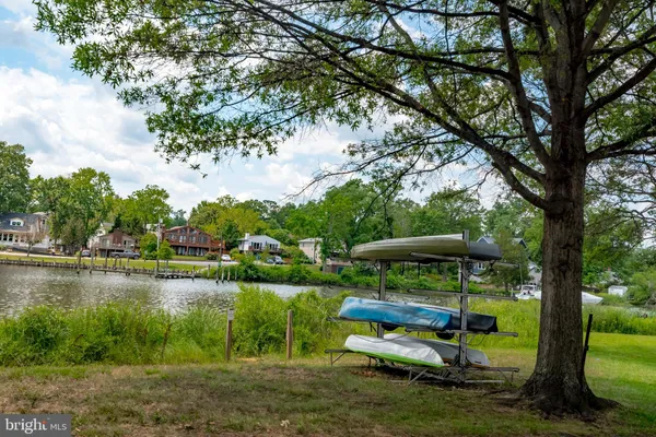 a view of a lake with houses in the back