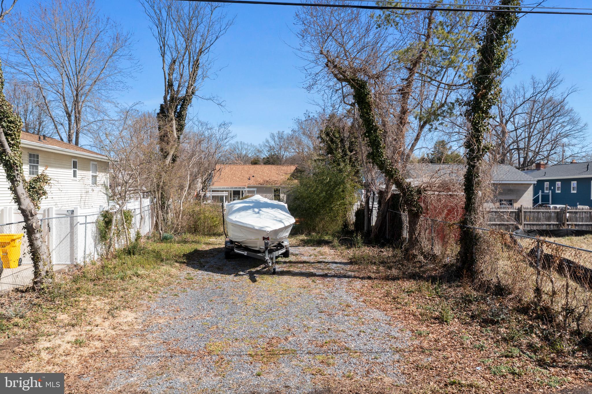 1505 Grange Road Edgewater, MD 21037 - Photo 2 of 45 a white house covered with tall trees