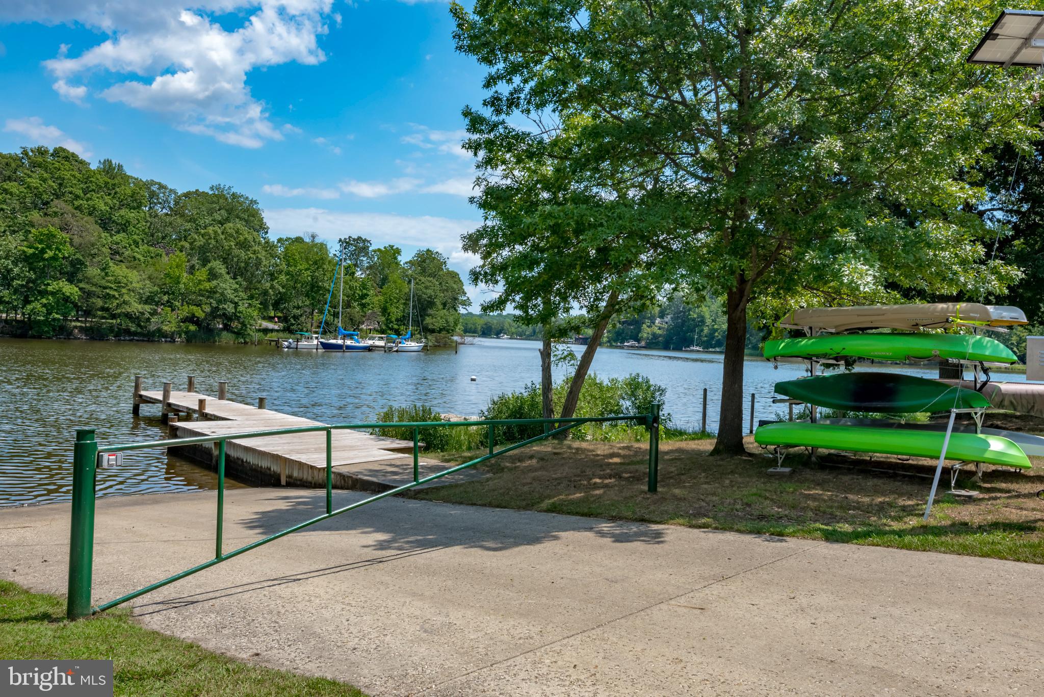 1505 Grange Road Edgewater, MD 21037 - Photo 24 of 45 a lake view with a bench and trees